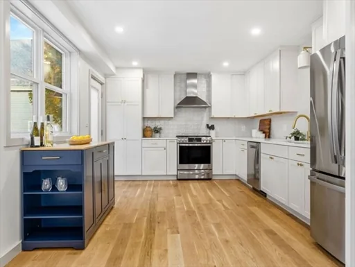 Completed kitchen renovation with white cabinetry