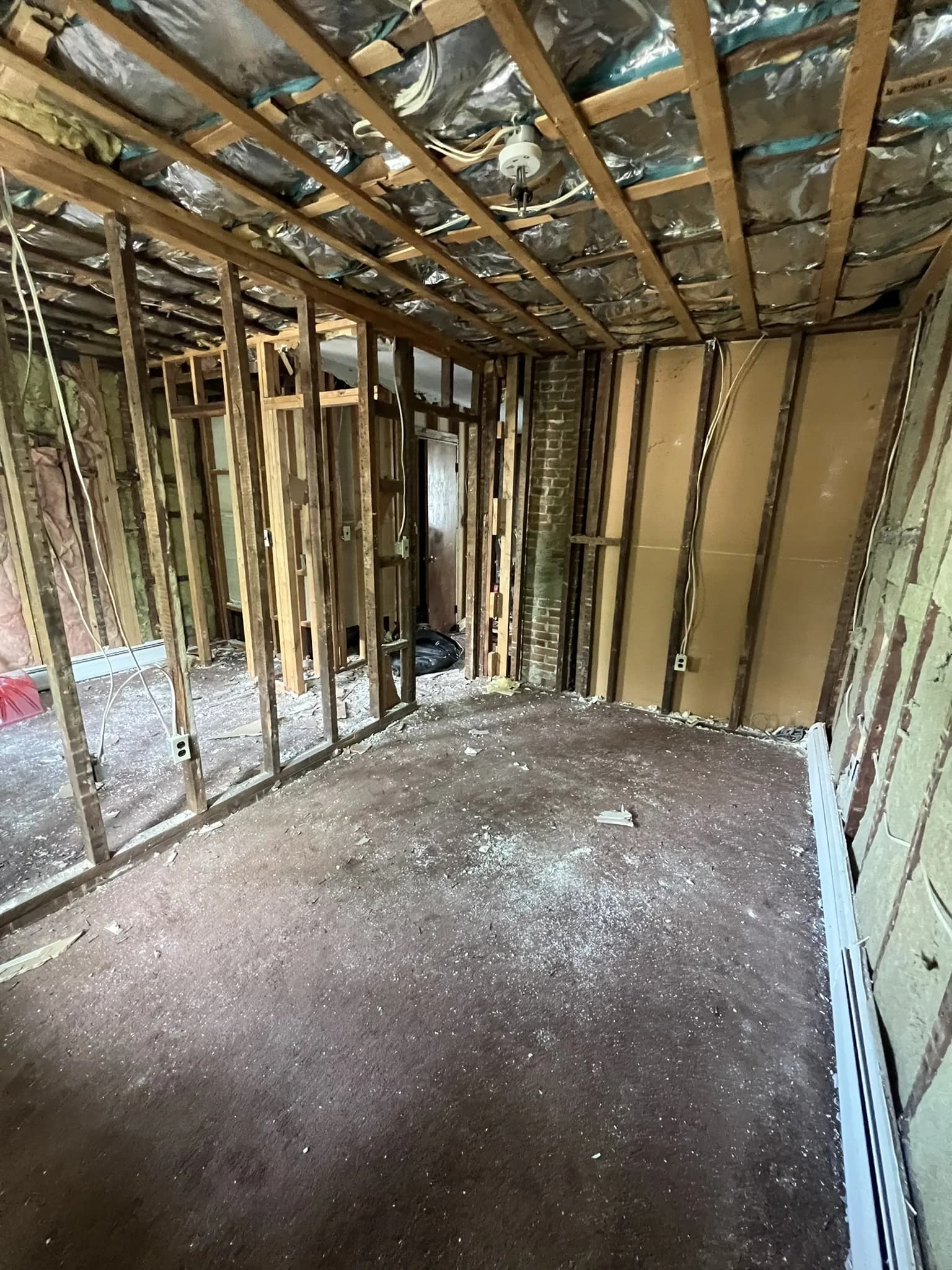 Wall framing exposed during an interior renovation